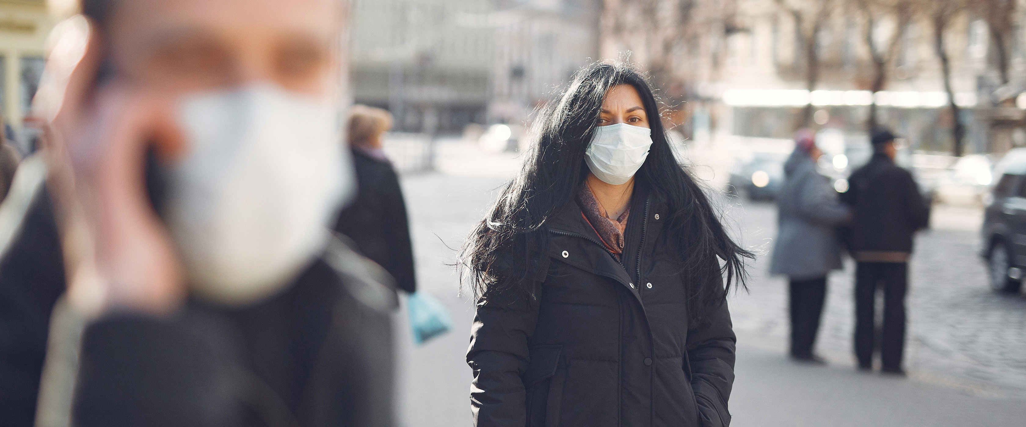 Social distancing: Concerned individuals wearing masks outdoors